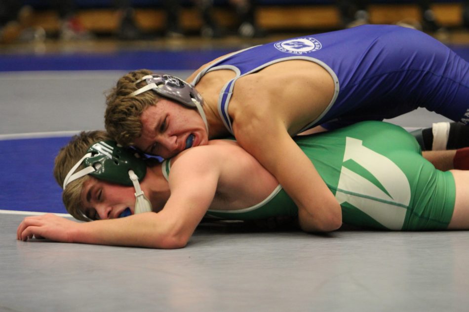 Gabriel Garcia (9) takes down opponent. After picking up the Valparaiso wrestler and throwing him to the ground, Gabriel takes on a well-earned win for the JV team. 