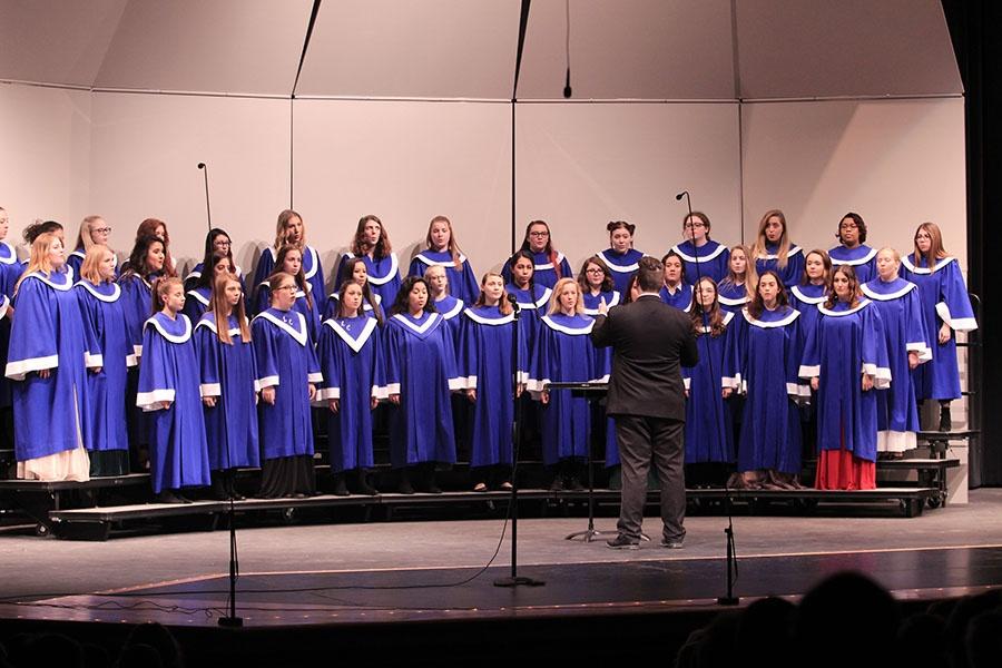 Mr. [Nathaniel] Jones [choir director] conducts the Senior Treble choir during their performance of December Child. The chorus also performed Welcome Christmas and Three Jazzy Bell Carols.  