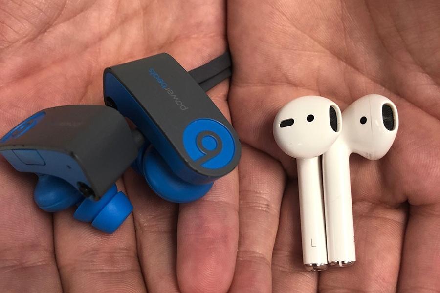 Rucinski holds her Bluetooth Beats and a friend’s Airpods. She purchased Airpods in the past, but returned them because she preferred Beats better. 