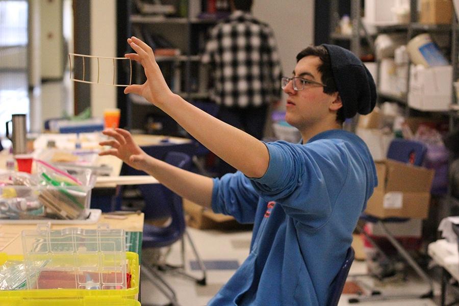 Elliot Basem (11) finishes his project for the next competition. The students met in order to practice for their upcoming competition. Science Olympiad met after school on Thursday, Feb, 21, in C221.
