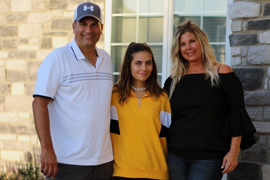 Claudia Alonso (11) poses with her host family. Alonso came to America one week before school started.