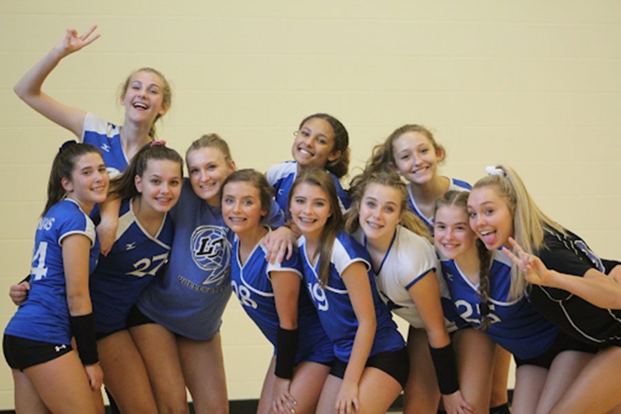 The Freshman girls volleyball team poses for a picture before their game against Michigan City. The team won all three of their matches.