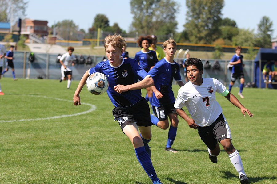 Matthew Schwer (11) runs towards the goal. Schwer was able to steal the ball many times.