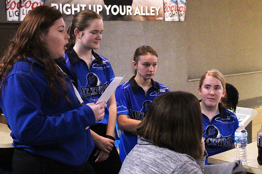 The team goes over the player order before the tournament begins. The girls were hopeful for a great end to the season.