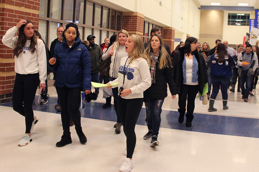  Madeline Shone (12) gives a tour of the school to parents. Students in the peer mentoring club attended the event to give tours and answer questions parents have.