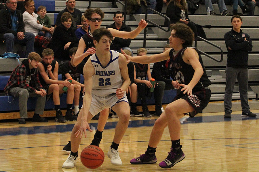 Conor McAllister (9) dribbles around his rival in order to make a pass to another teammate. The boys were able to keep the lead throughout the whole game.