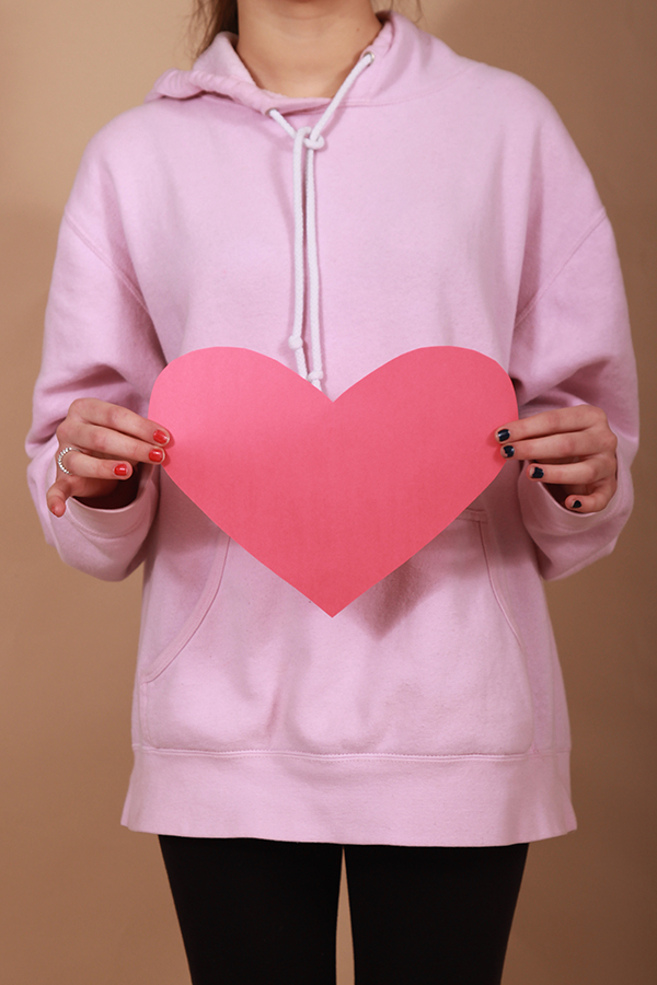 Brenna Polovina (10) holds up a cut-out heart. Valentine’s Day is celebrated yearly on Feb. 14.
