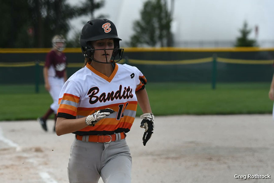 Sydney Doloszycki (10) sprints to the base. She played for Varsity and a travel softball team. Photo submitted by: Sydney Doloszycki (10)