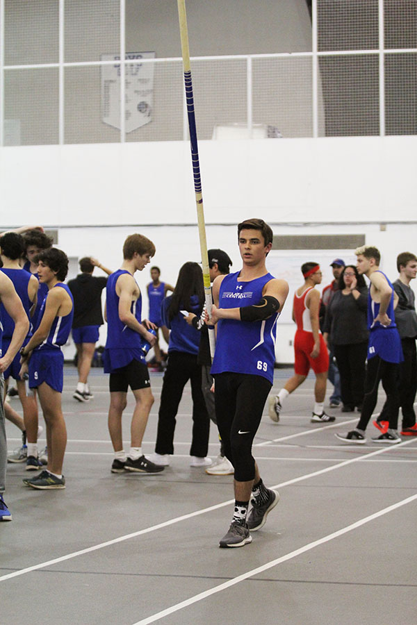 Doug Belcaster (12) prepares for his next attempt on pole vaulting. Belcaster passed multiple heights during the meet. 