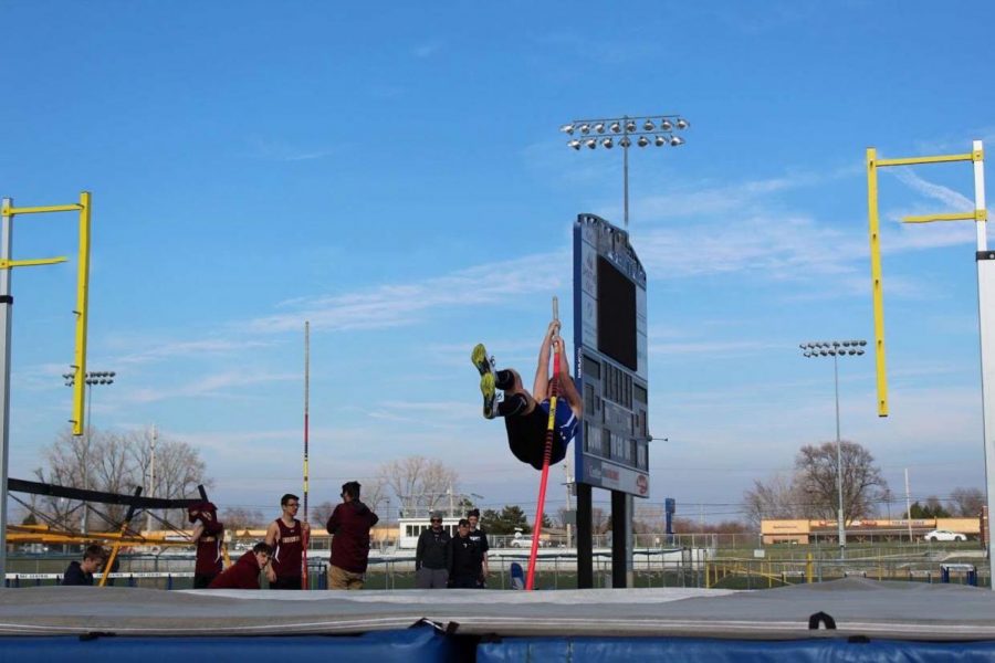 Aidan O’Neill (12)  practices pole vaulting before his meet against Chesterton. O’Neill’s best jump was 11 feet 6 inches. 