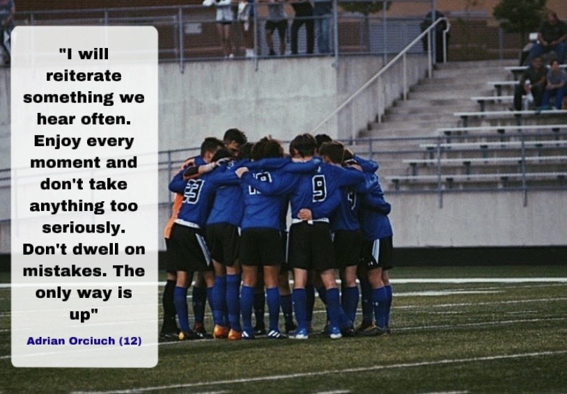 The soccer team huddles up to discuss the game and encourage one another. The soccer team was a close knit team this year. 