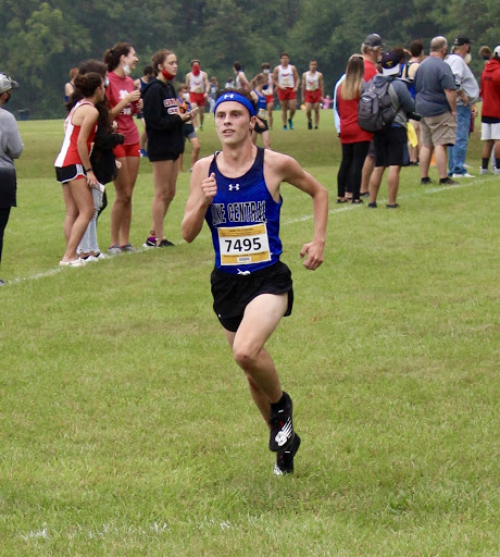 Logan Russell (12) runs at the Bob Thomas invite. Logan passed up two people on his way to the finish. 