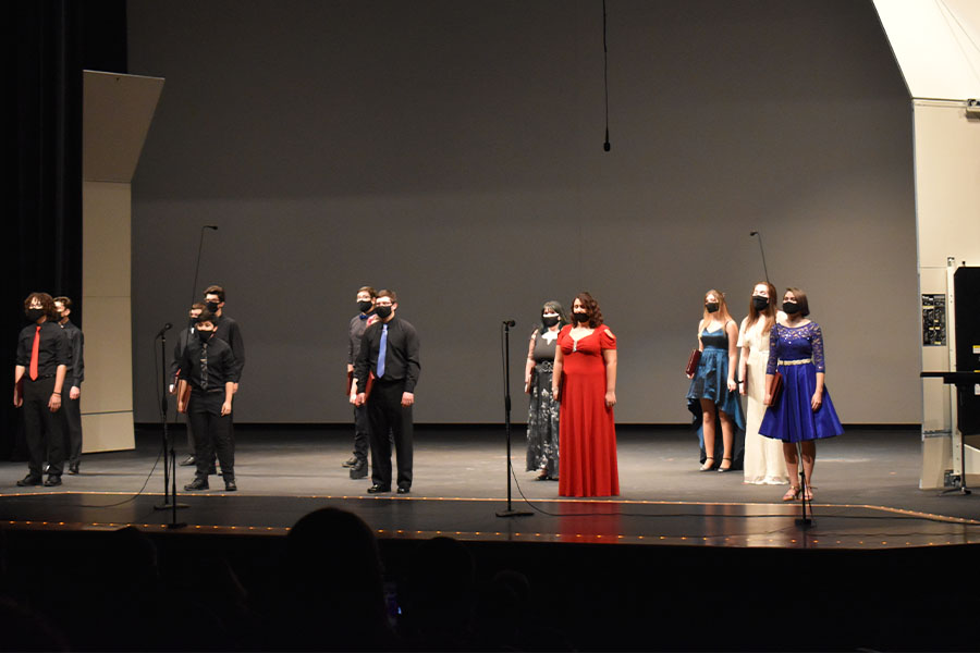 The Varsity choir singing. They were second in the program and contrasted with the other choirs by wearing all black.