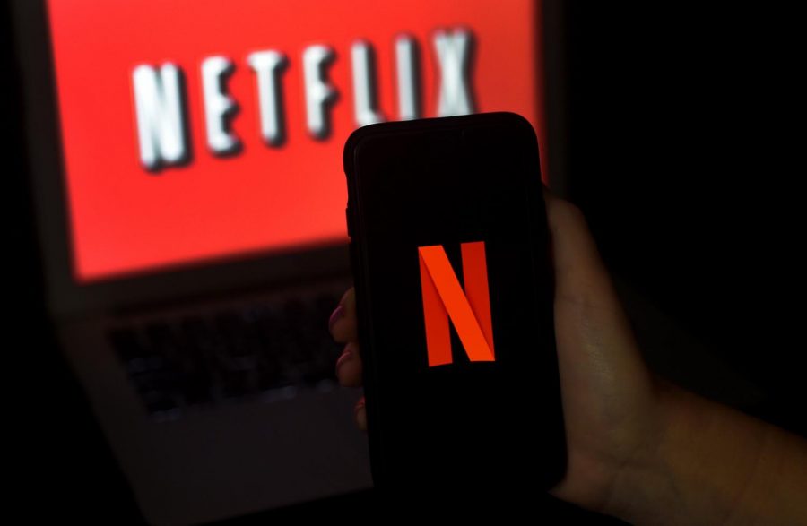 Netflix offers a variety of TV shows/movies to allow for everyone to enjoy and watch their favorite shows wherever they go. In 2020, 73.94 million people streamed Netflix on a device. (Olivier DOULIERY AFP via Getty Images/TNS)

