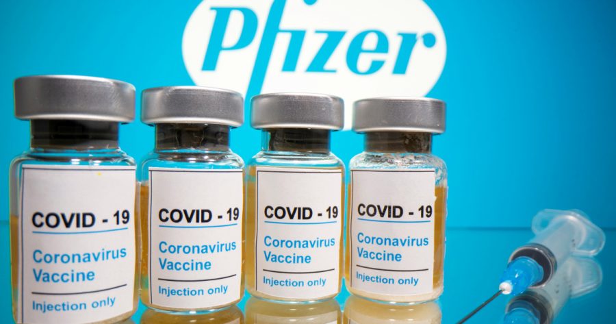 The COVID-19 vaccine started to be administered around a month ago.  As of right now, only certain designated groups are allowed to receive it.FILE PHOTO: Vials with a sticker reading, COVID-19 / Coronavirus vaccine / Injection only and a medical syringe are seen in front of a displayed Pfizer logo in this illustration taken October 31, 2020.