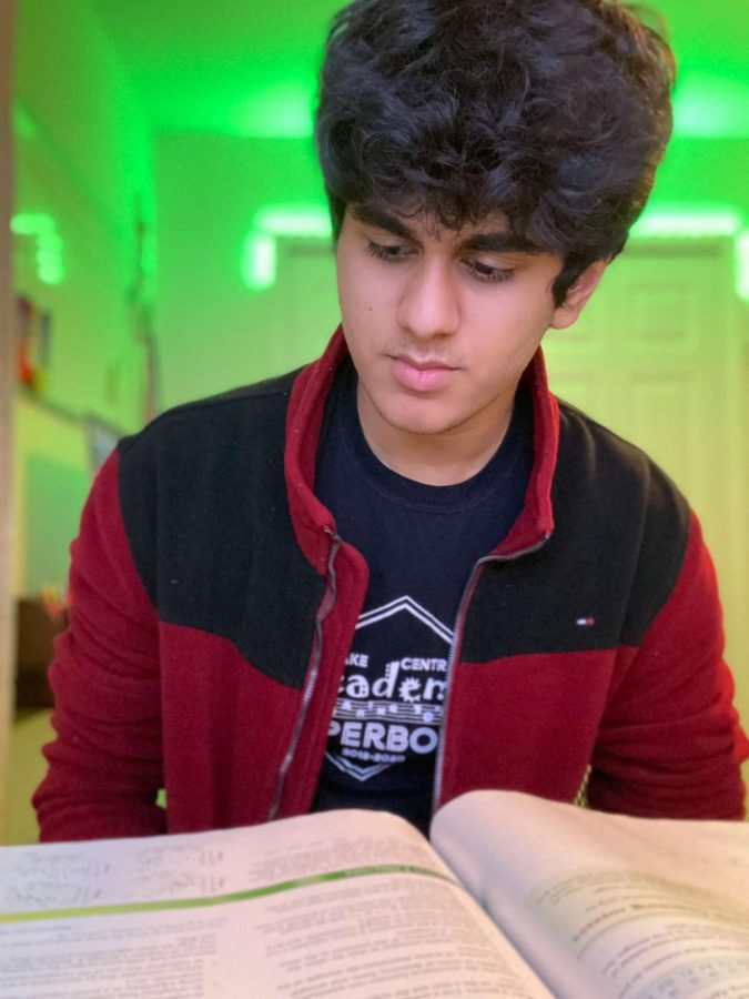 Aneesh Poddutur (12) prepares for an AP Statistics test. Poddutur reflected on his experiences, efforts and accomplishments after being named a National Merit Scholarship Finalist along with Claire Lavoie (12).
