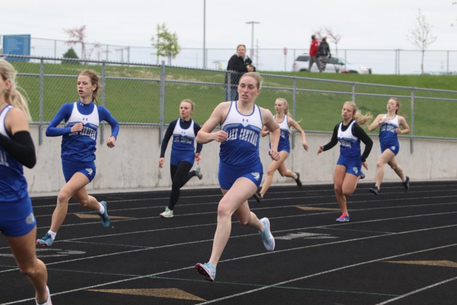 Emily Thomas (12) and others get off to a quick start for the 800m race.  Abby Martisek placed first in this event.