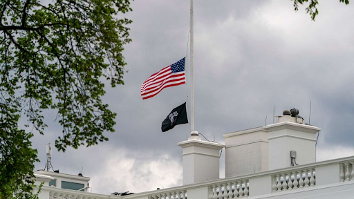 The American flag above the White House flies at half-mast April 16, 2021. (Andrew Harnik/AP)