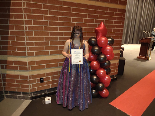 Allison Peterson (12) receives her thespian cords for graduation. Theatre had been an outlet for her to express her creativity and make new friends throughout her years in high school. 