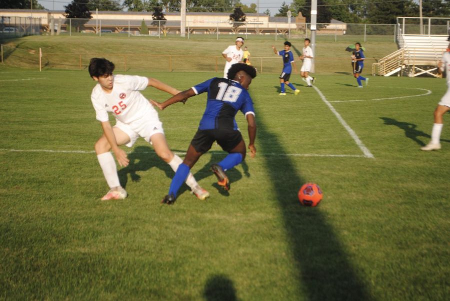 David Reed (10), cuts a defender and passes for a great opportunity for the team.  The opportunity was missed but the boys played on with this same aggressiveness throughout the game.