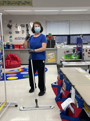 Rada Marinkovich, Custodian, sweeps a classroom at Kolling Elementary School. She has worked for Lake Central as a custodian for over 14 years.