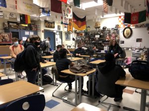 The History Club members are watching the presentation of the day.  They paid close attention to what was being discussed.