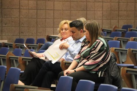 Reviewing the Middle School Handbooks with the board is Grimmer Middle School Assistant Principal, Mario Castaneda. The board continued to pass the handbook for next school year. 