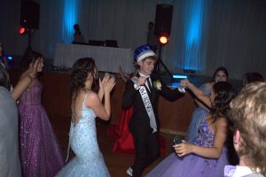 Kyle Kennedy (12) dances with his friends at prom. Kennedy and Lily Rogers (12) won senior prom king and queen.