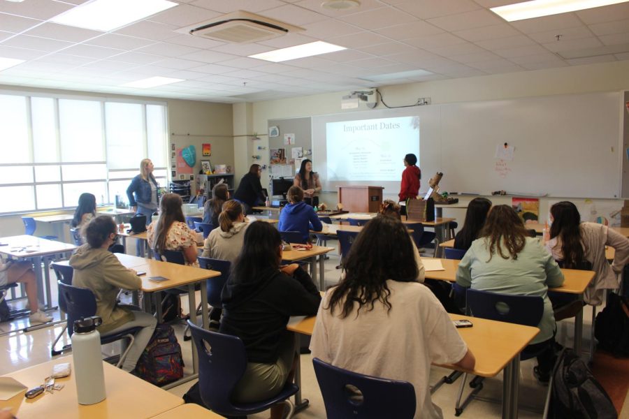 Members of the Senior Class Cabinet listen as the president and vice president go through important senior dates. This is the seniors last class cabinet meeting. 