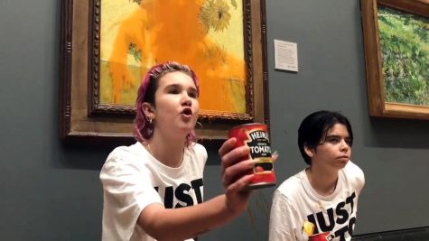 Just Stop Oil protesters glued themselves to the wall, then threw tomato soup at Vincent Van Goghs iconic Sunflowers, at the National Gallery on Oct. 14, 2022, in London. (Just Stop Oil/Zuma Press/TNS)