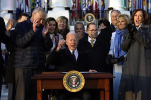   U.S. President Joe Biden signs the Respect for Marriage Act during a ceremony on the South Lawn of the White House in Washington, D.C., on Tuesday, Dec. 13, 2022. (Yuri Gripas/Abaca Press/TNS)