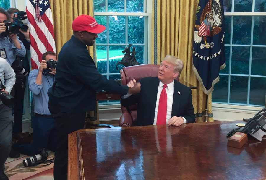 US President Donald Trump meets with rapper Kanye West in the Oval Office of the White House in Washington, DC, Oct. 11, 2018. (Sebastian Smith/AFP via Getty Images/TNS)