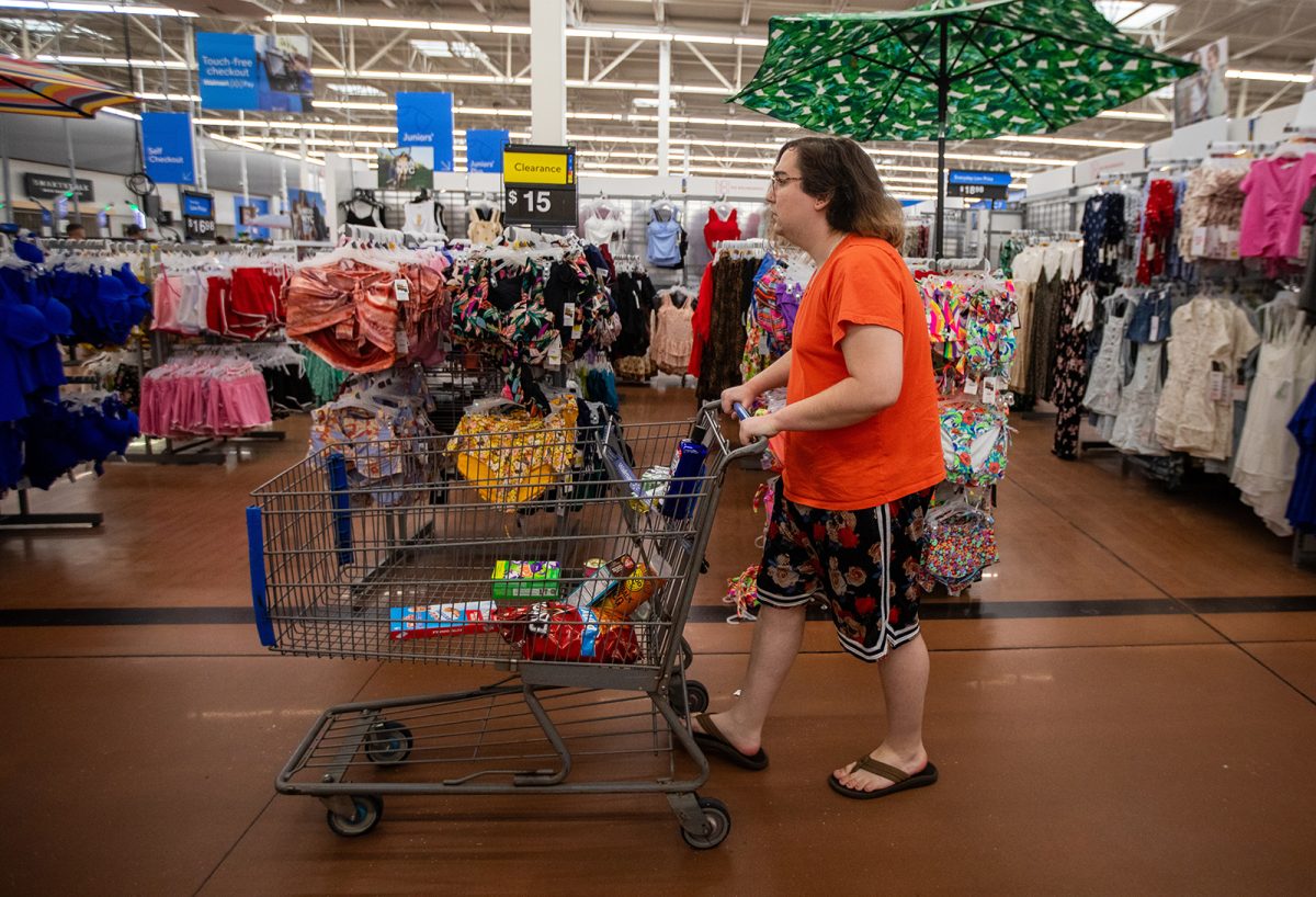 Rin quickly moves through a store during a shopping trip. She said going out has become more stressful since new laws were signed to restrict the rights of transgender people. (Francine Orr/Los Angeles Times/TNS)