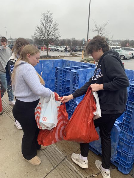 While ending the trip to Target for Angel Tree, Dominic Rizzo (12) and Genevieve Cosgrove (10) take bags full of gifts to load up onto the truck for Angel Tree that will then be taken to Salvation Army. This is an event put on by the Student Council every year. “We’re here shopping for kids from Angel Tree. We are getting all kinds of toys and hygiene items,” Rizzo said.