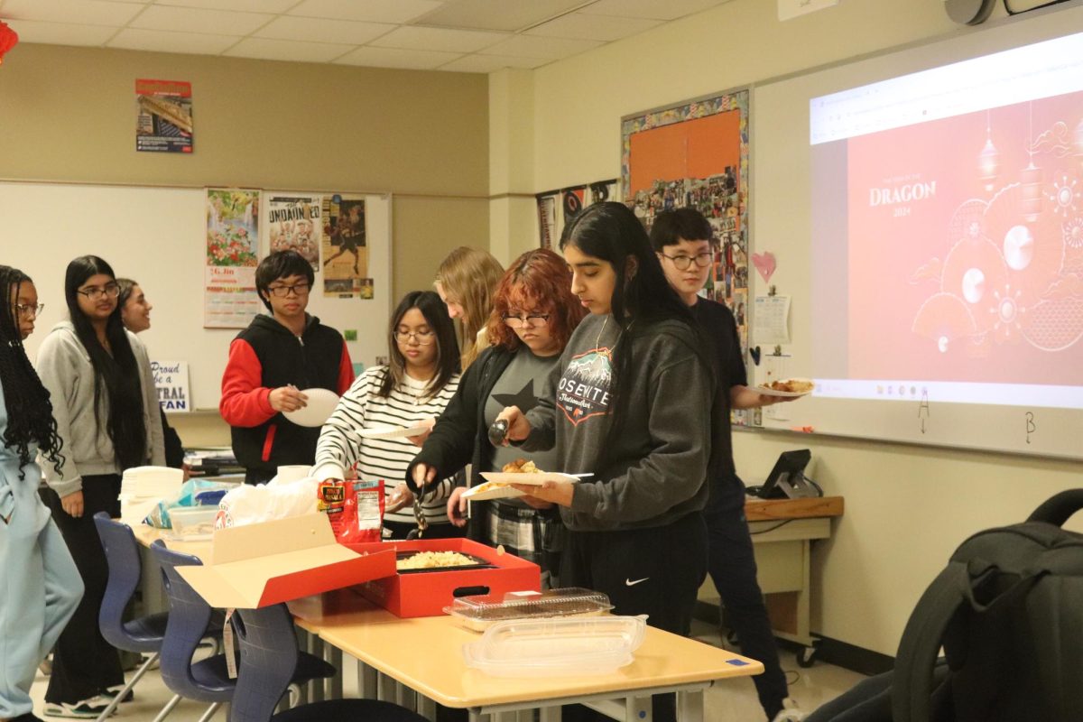 Courtesy of their advisor, Mr. Joe Bafia (Economics), the Asian American Culture Club eats orange chicken and stir fried rice from Panda Express. Each member was able to get a plate of food, some were even able to get seconds.