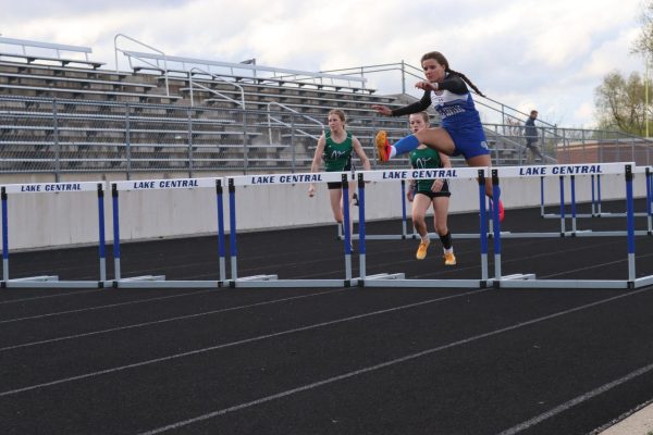 Running the 100 meter hurdles, Allison Kreuger (9) races to the finish line. Krueger got first place in her heat and eighth place overall. 