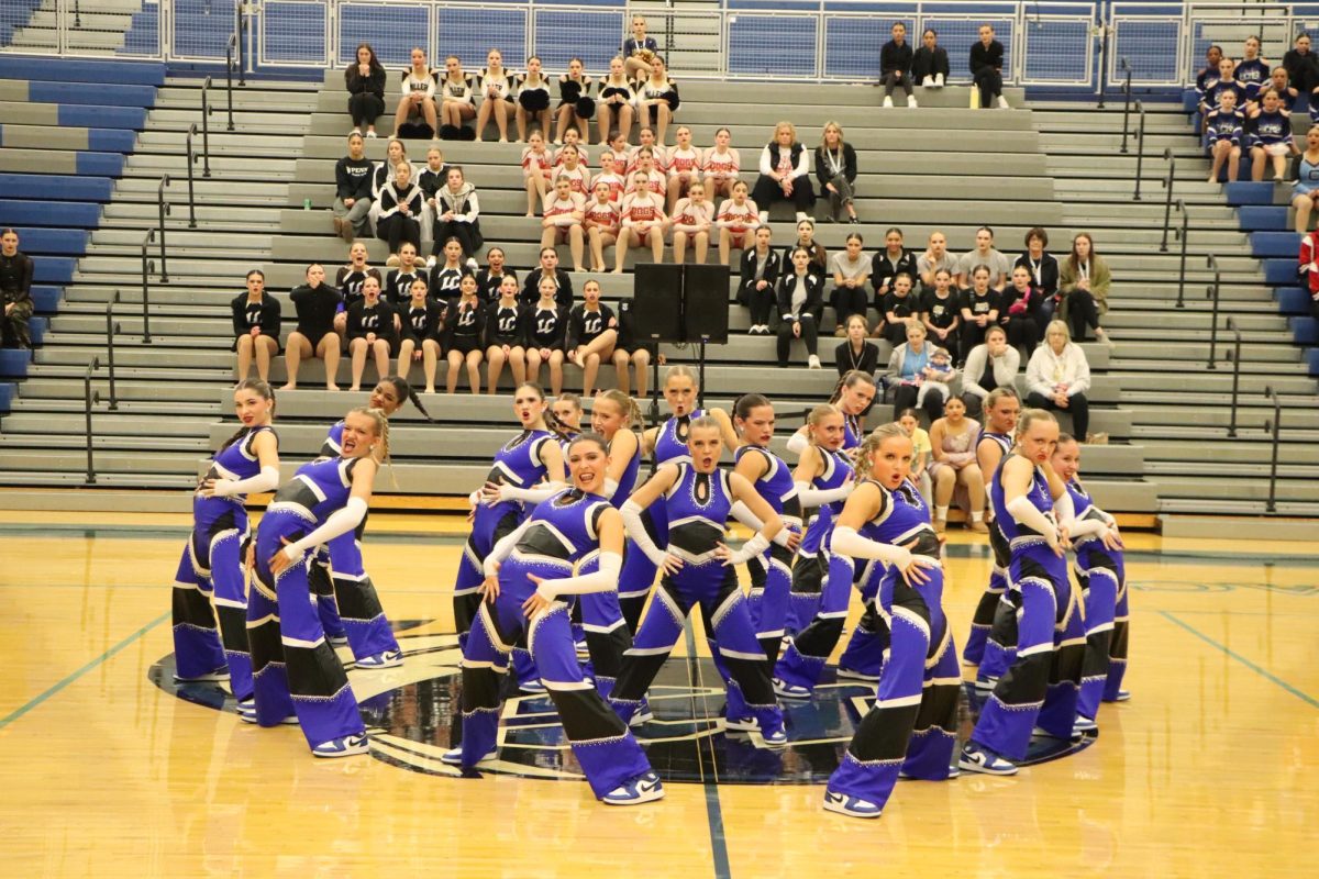 In a circular formation, the varsity Centralettes start their hip hop routine. This was their last performance before going to NDA Dance Nationals, where they hoped to continue their first place streak. “We have 56 state champions and about 21 national championships in a row, so we had to keep that up,” Hailey Danielson (9) said. 